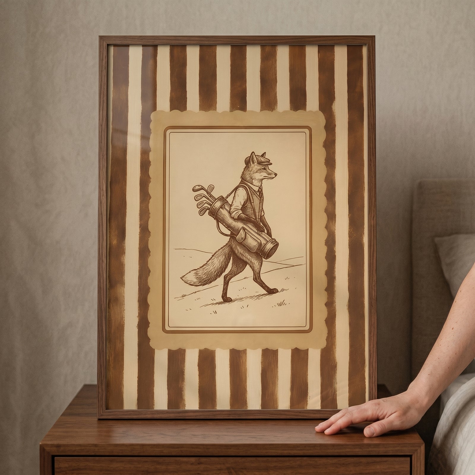 Framed vintage sepia golfing fox wall art depicts a fox in a cap carrying golf clubs against a striped background.