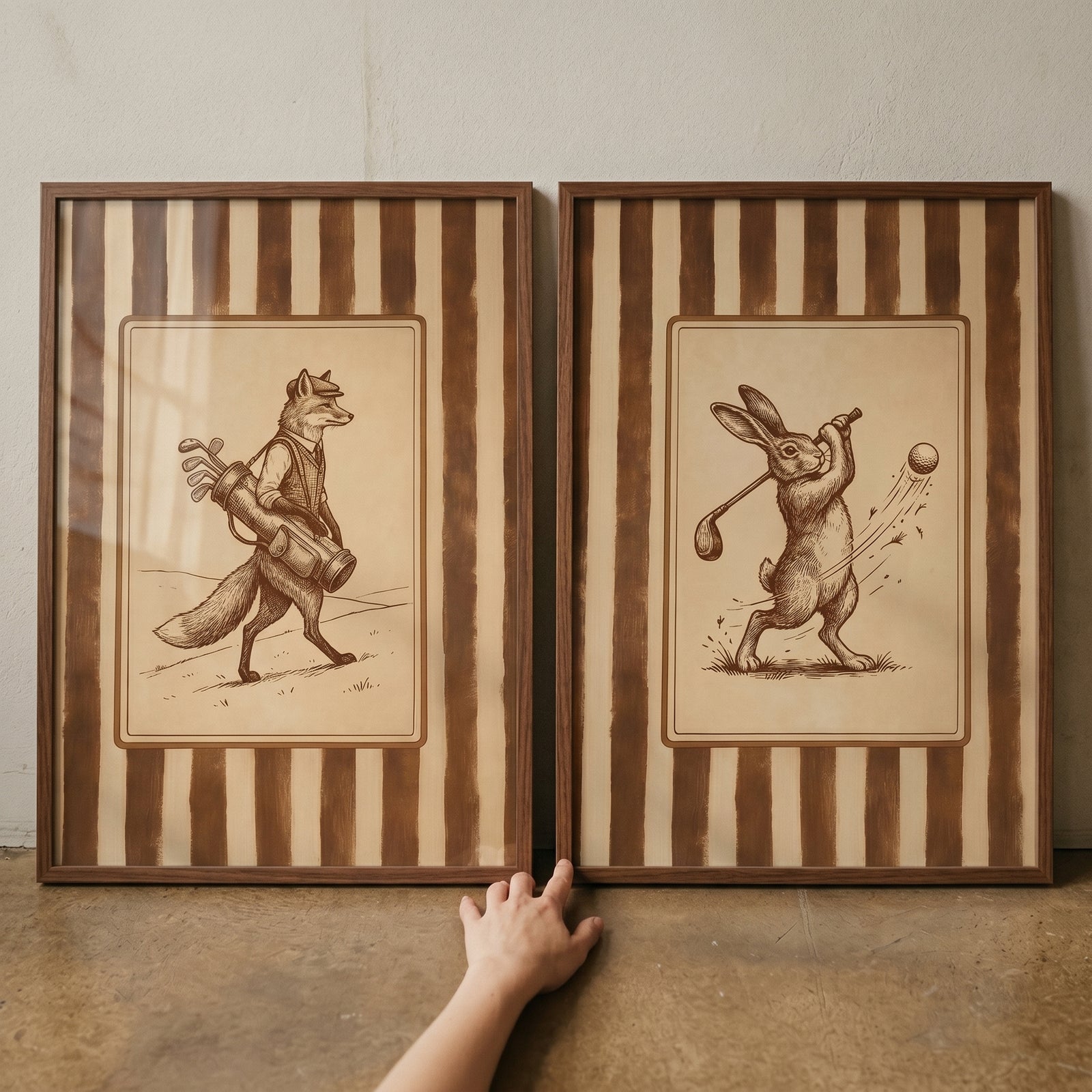 Vintage sketch golfing animal wall art set of 2 showing a fox caddy and a rabbit swinging a club in brown striped frames.