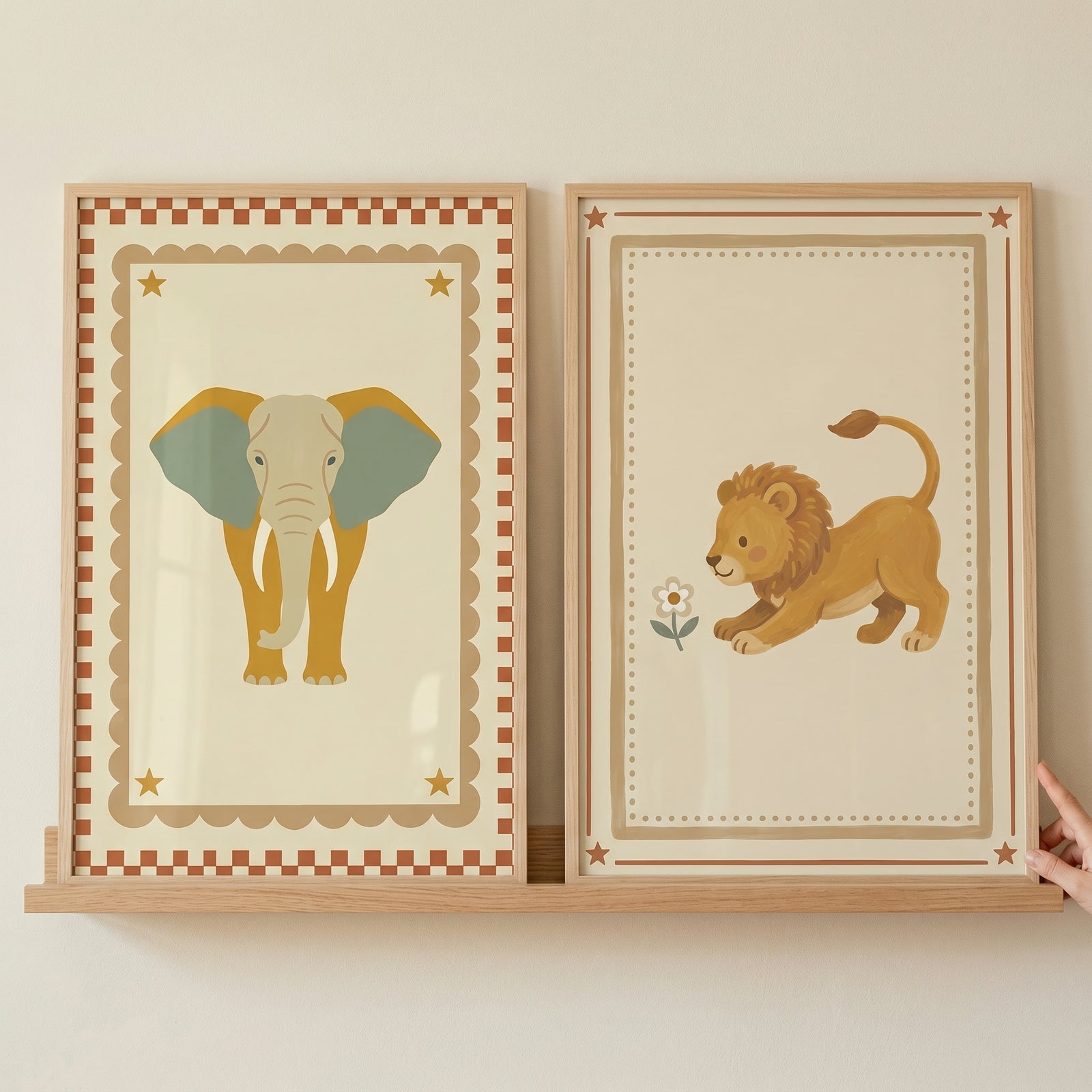 Vintage star safari animals wall art set of 2 featuring an elephant and lion in decorative frames on a wooden shelf.