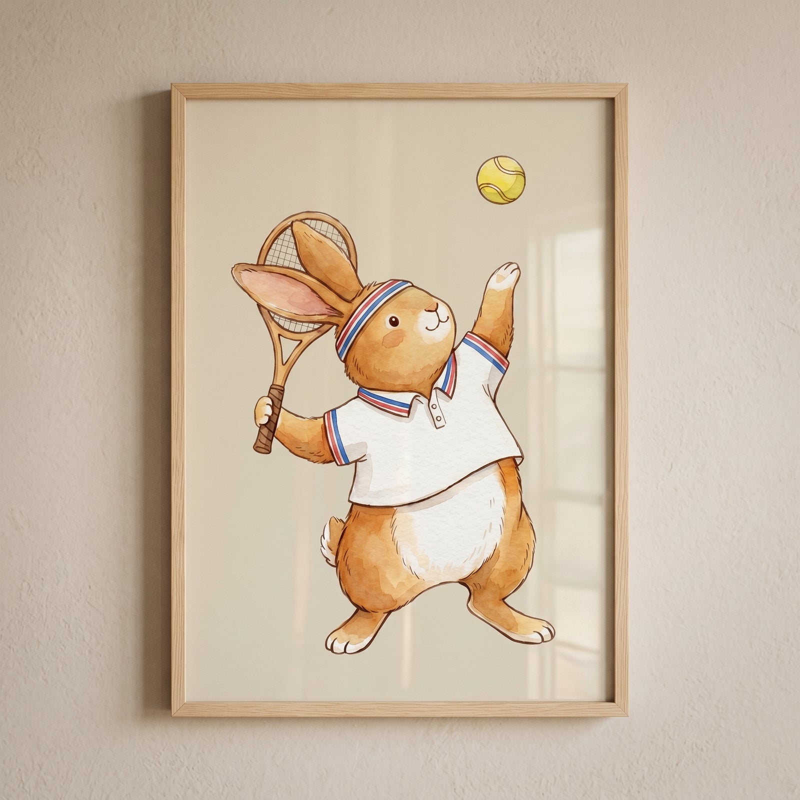 Framed vintage style tennis bunny artwork features a rabbit in a polo shirt and headband about to hit a tennis ball.