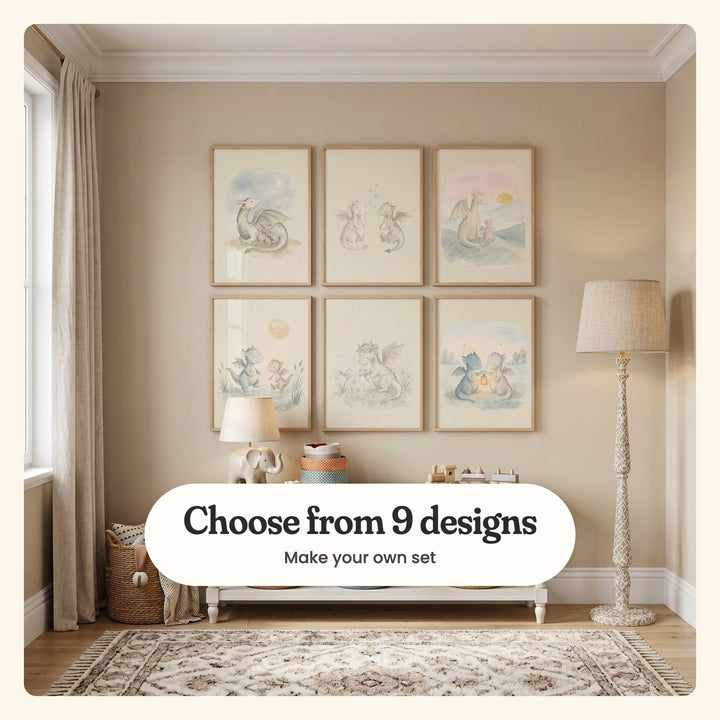 Nursery with six baby dragon prints in light wood frames in two rows on a beige wall, above a white bench with an elephant lamp, woven baskets and a wooden toy train, beside linen curtains and a patterned rug: a mother dragon curled round her baby under the moon, two dragons with hearts, two watching the sunset, two splashing in a puddle, one in a daisy crown and two holding a lantern, labeled Choose from 9 designs, Make your own set