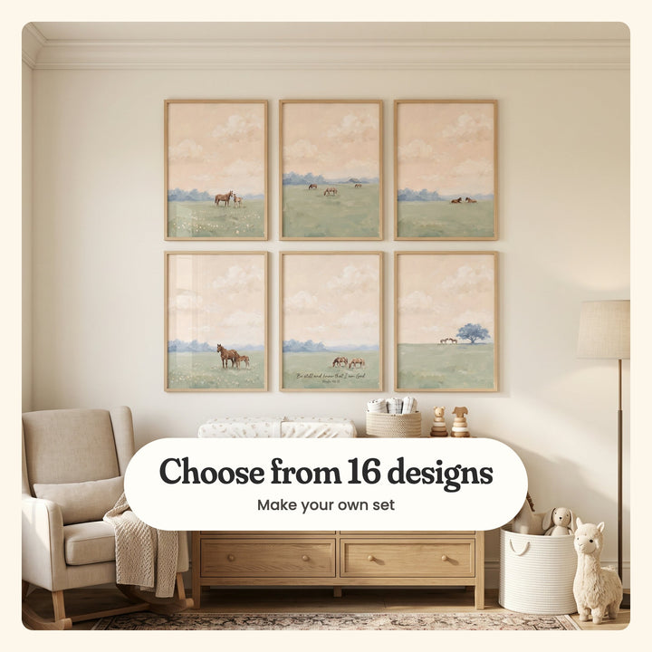 Nursery with six peach sky horse prints in light wood frames in two rows above a wood dresser with a changing pad and wooden bear toys, beside a beige rocking chair, a floor lamp and a plush llama: a mare and foal, three horses grazing near a barn, two horses resting, a brown mare and foal, two horses with the verse Be still and know that I am God and two horses by a blue tree, labeled Choose from 16 designs, Make your own set