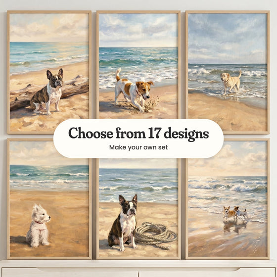 Six beach dog prints in light wood frames in two rows above a white cabinet: a brindle French bulldog by a driftwood log, a Jack Russell terrier digging in the sand, a yellow Labrador trotting out of the surf, a West Highland white terrier in a red collar, a Boston terrier by a coil of rope and a corgi running with a Jack Russell, with a label reading Choose from 17 designs, Make your own set