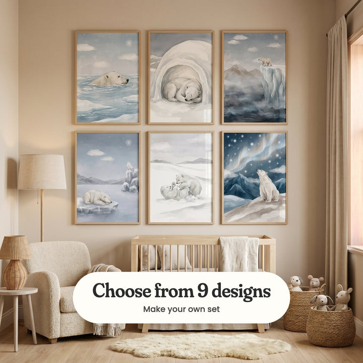 Cream nursery with six polar bear prints in light wood frames in two rows above a light wood crib, beside a cream armchair, a rattan lamp, a floor lamp and baskets of plush toys: Arctic Night Swim, Arctic Slumber, Ice Cliff Lookout, Starlit Polar Night, Arctic Cub Play and Northern Lights Bear, with a label reading Choose from 9 designs, Make your own set
