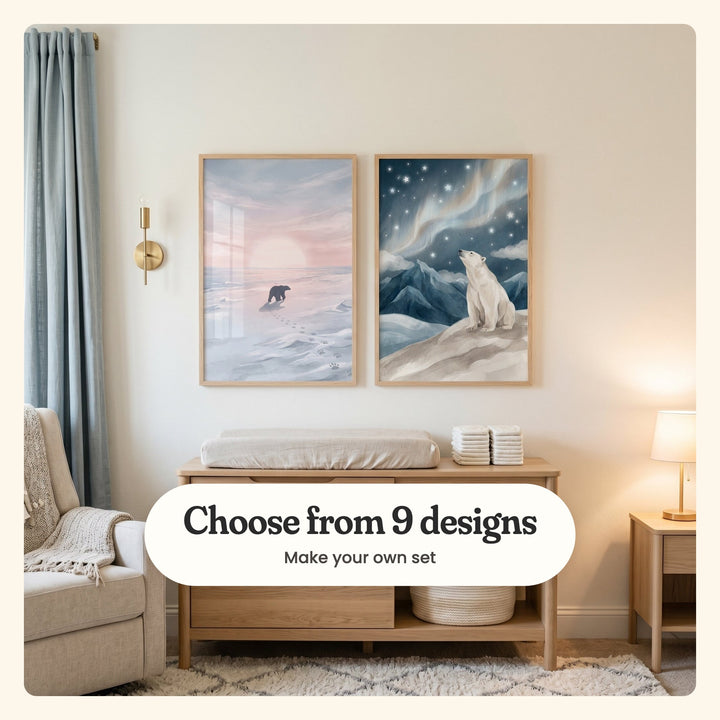 Cream nursery with two polar bear prints in light wood frames above a light wood changing table with folded cloths, beside a cream armchair and a table lamp: Arctic Horizon Glow and Northern Lights Bear, labeled Choose from 9 designs, Make your own set