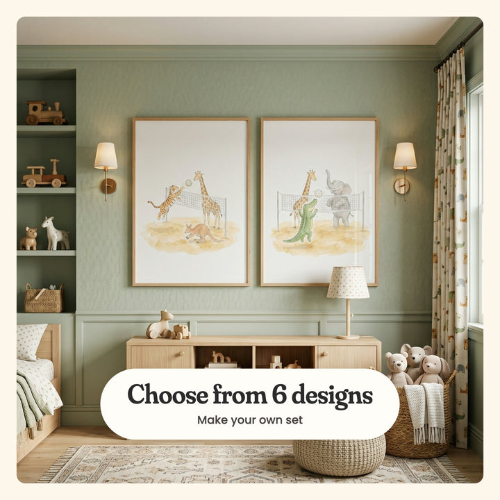 Sage green nursery with two volleyball animal prints in light wood frames between two wall lights, above a wood console with toys and a dotted lamp, beside a bed and plush bears: Wild Beach Volley and Safari Beach Match, labeled Choose from 6 designs, Make your own set