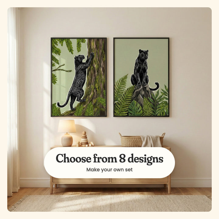 Cream room with two panther prints in black frames above a light wood console with a lamp, a wooden stacking toy and a basket with a blanket: Midnight Tree Climber and Midnight Forest Watcher, labeled Choose from 8 designs, Make your own set