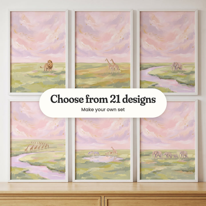 Six blush sky savanna prints in white frames in two rows above a light wood dresser: a lion standing in the grass, two giraffes, an elephant by a lilac river, a long line of giraffes by a river, zebras, antelope and a giraffe at a waterhole and an elephant family walking, with a label reading Choose from 21 designs, Make your own set