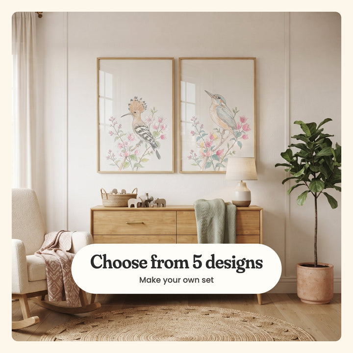 Cream panelled nursery with two bird prints in light wood frames above a light wood dresser with a table lamp and wooden toys, beside a cream rocking chair and a potted tree: Hoopoe Among Blossoms and Serene Kingfisher Bloom, labeled Choose from 5 designs, Make your own set