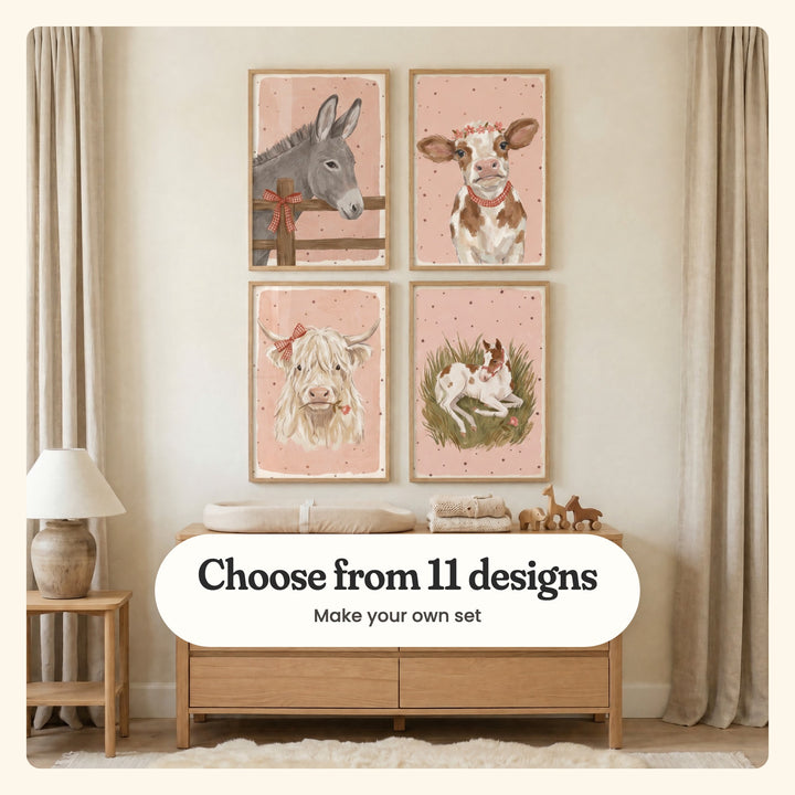 Cream nursery with four farm animal prints in light wood frames in two rows above a light wood changing dresser with folded clothes and wooden horse toys, beside a table lamp: Sweet Gingham Donkey, Sweet Floral Calf, Highland Sweetheart and Spotted Foal Rest, labeled Choose from 11 designs, Make your own set