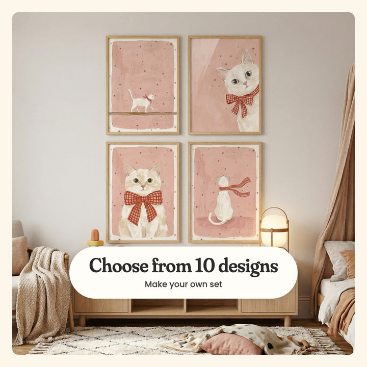 Kids' room with four cat prints in light wood frames in two rows above a light wood cabinet with a lantern lamp, beside a canopy bed and an armchair with a knit throw: a white cat walking along a ledge, a white cat peeking in with a bow, a cream cat in a big bow and a white cat seen from behind in a scarf, labeled Choose from 10 designs, Make your own set