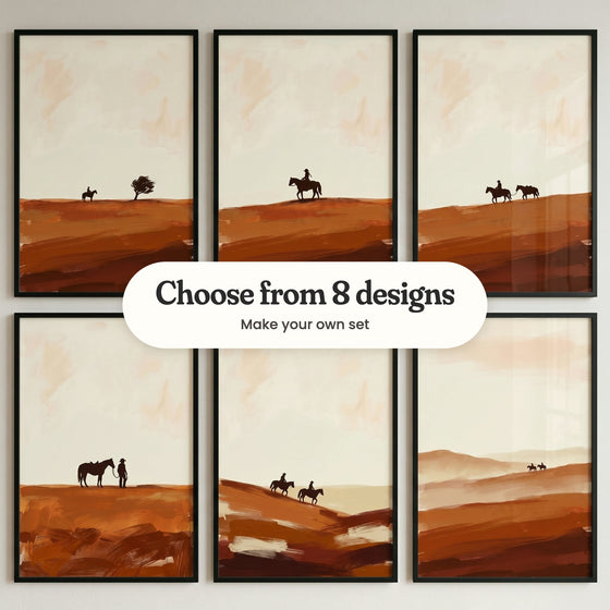 Six desert cowboy prints in black frames in two rows on a pale wall, black silhouettes on terracotta hills: a rider by a windblown tree, a lone rider on a hilltop, a rider leading a packhorse, a cowboy beside his horse, two riders heading downhill and two tiny riders on far hills, with a label reading Choose from 8 designs, Make your own set