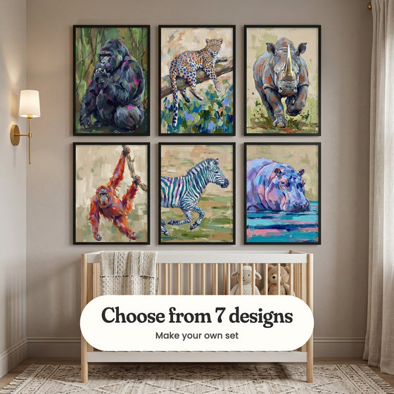 Nursery with six wild animal prints in black frames in two rows above a light wood crib with plush toys, beside a brass wall light: Majestic Jungle Spirit, Vibrant Wild Gaze, Charging Rhino, Radiant Jungle Swing, Striped Indigo Stride and Violet River Giant, with a label reading Choose from 7 designs, Make your own set