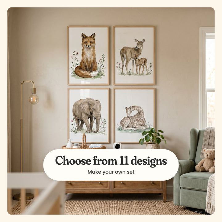 Nursery with four animal prints in light wood frames above a wooden dresser, beside a sage green armchair with a teddy bear and a brass floor lamp: a sitting fox, a doe with her fawn, an elephant and a sleeping giraffe, labeled Choose from 11 designs, Make your own set
