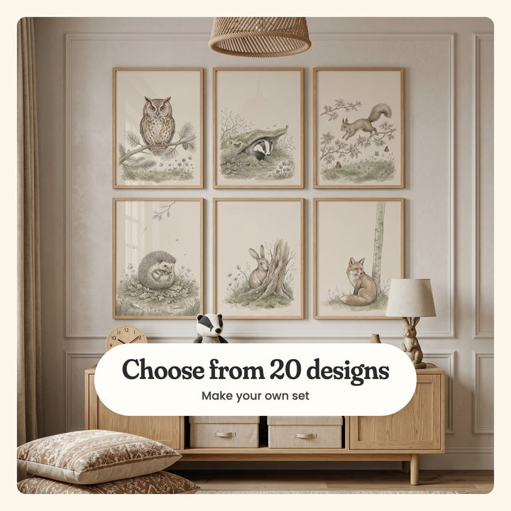 Kids' room with six sketch-style animal prints in light wood frames in two rows on a panelled wall under a woven pendant, above an oak sideboard with fabric bins and a bunny lamp: an owl on a pine branch, a badger peeking from a mossy den, a squirrel leaping through blossoms, a hedgehog curled in oak leaves, a rabbit by a tree stump and a fox by a birch, labeled Choose from 20 designs, Make your own set