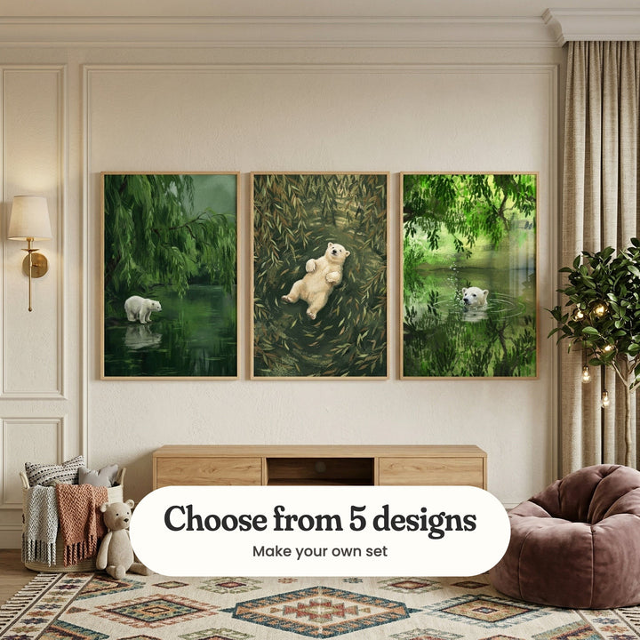 Cream panelled room with three polar bear prints in light wood frames above a low wood console, beside a wall light, a basket of throws, a teddy bear and a velvet bean bag: Arctic Willow Reflection, Polar Bear Float and Forest Bear Bubbles, with a label reading Choose from 5 designs, Make your own set