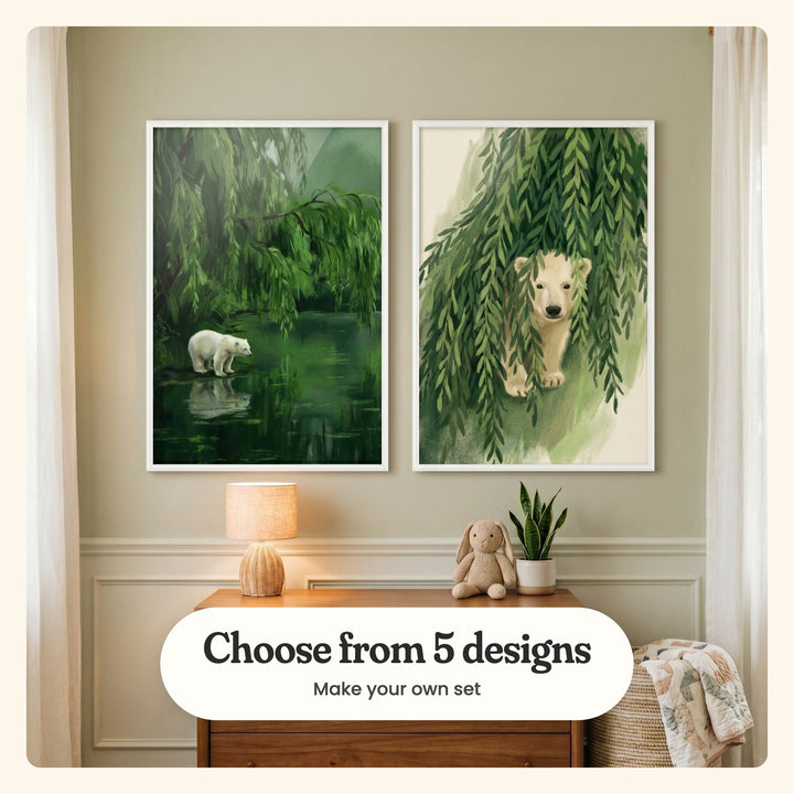 Sage room with two polar bear prints in white frames above a wood dresser with a woven lamp, a plush bunny and a small plant: Arctic Willow Reflection and Hidden Polar Cub, labeled Choose from 5 designs, Make your own set