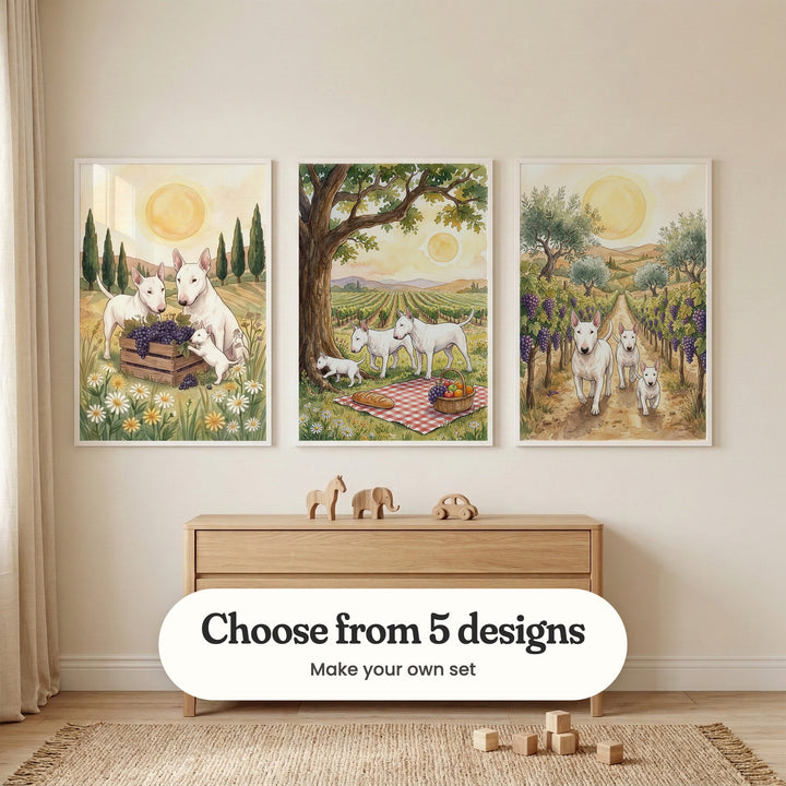 Cream room with three vineyard dog prints in white frames above a light wood dresser with wooden toys, on a woven rug with wooden blocks: Vineyard Harvest Pups, Vineyard Picnic Pups and Golden Vineyard Walk, with a label reading Choose from 5 designs, Make your own set