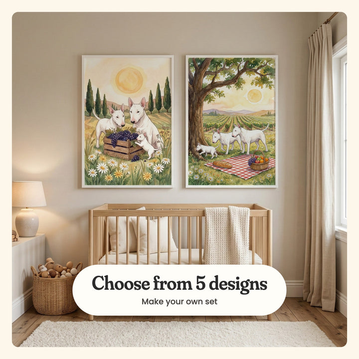 Beige nursery with two vineyard dog prints in white frames above a wooden crib with a knit blanket, beside a table lamp, a basket of toys and a white rug: Vineyard Harvest Pups and Vineyard Picnic Pups, labeled Choose from 5 designs, Make your own set