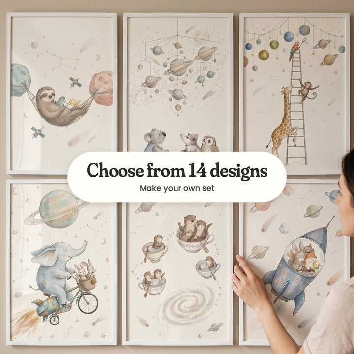 Six space adventure animal prints in white frames on a wall while a woman straightens one, with a label reading Choose from 14 designs, Make your own set
