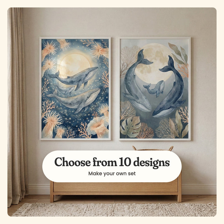 Cream room with two whale prints in white frames above a low light wood chest with a woven basket, beside a linen curtain and a fringed rug: Moonlit Ocean Glow and Moonlit Whale Family, labeled Choose from 10 designs, Make your own set
