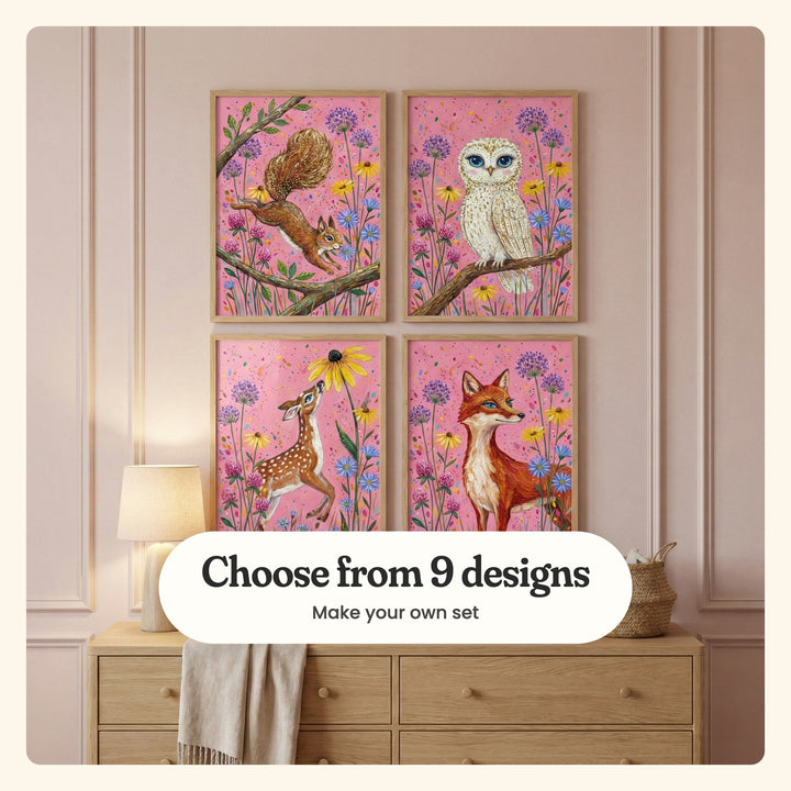 Blush panelled wall with four forest animal prints in light wood frames in two rows above an oak dresser with a cream lamp, a linen throw and a woven basket: a squirrel leaping between branches, a white owl on a branch, a spotted fawn sniffing a coneflower and a red fox among wildflowers, labeled Choose from 9 designs, Make your own set