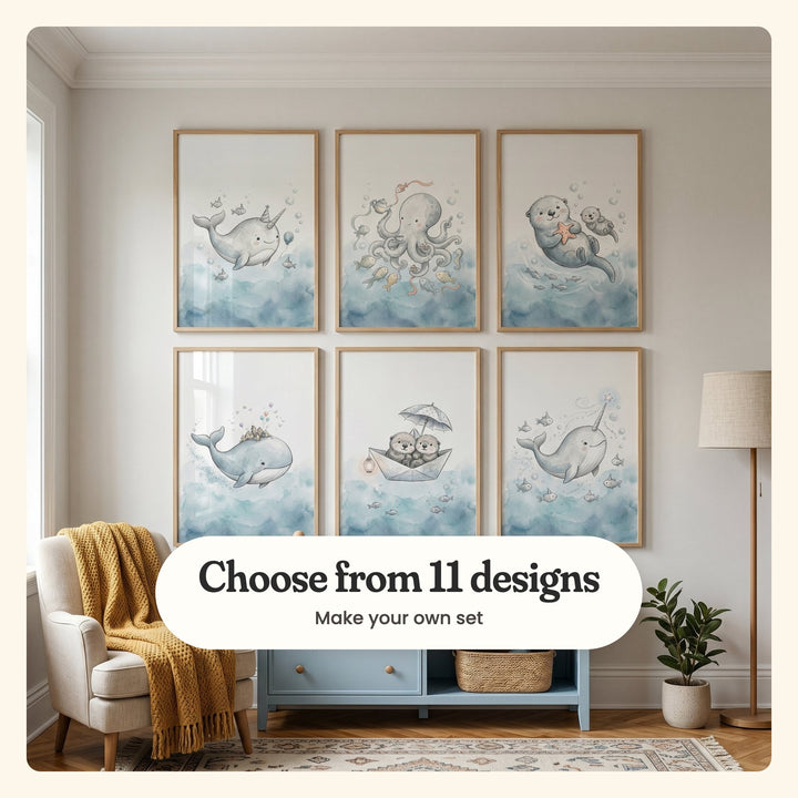 Six sea animal prints in light wood frames in two rows above a powder blue cabinet with a woven basket, beside a cream armchair with a mustard knit throw, a floor lamp and a potted plant on a patterned rug: a narwhal in a party hat, an octopus at a tea party, a sea otter hugging a starfish, a whale with a tiny village on its back, two otters in a paper boat and a narwhal with a star on its tusk, labeled Choose from 11 designs, Make your own set