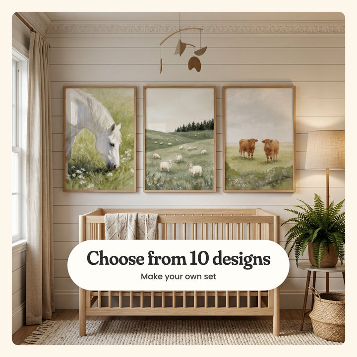 Nursery with three farm prints in light wood frames on a shiplap wall under a wooden mobile, above a light wood crib with a knit blanket, beside a linen curtain, a floor lamp and a fern on a side table: a white horse grazing, sheep on green hills and two brown cows in a pasture, labeled Choose from 10 designs, Make your own set