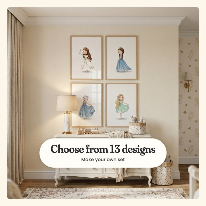 Nursery with four little princess prints in light wood frames in two rows above a white dresser with a marble lamp, a wooden toy train and a spotted basket of plush toys, beside star-and-tulip wallpaper: a girl in a white gown waving a wand, a girl with braids in a blue gown, a silver-haired girl in a blue gown and a blonde girl in a mint dress, labeled Choose from 13 designs, Make your own set