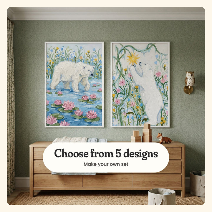 Sage green nursery with two polar bear prints in white frames above a light wood dresser with wooden blocks and a small wooden fox, beside an owl wall lamp: Arctic Lily Stroll and Bear In Bloom, labeled Choose from 5 designs, Make your own set