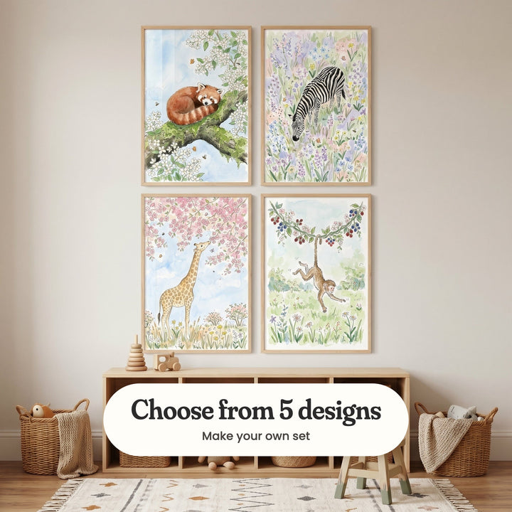 Cream room with four animal prints in light wood frames in two rows above a low wood cube shelf with a stacking toy and a toy car, beside woven baskets and a small wooden stool: Spring Blossom Nap, Striped Garden Bliss, Giraffe Blossom Dream and Playful Berry Monkey, with a label reading Choose from 5 designs, Make your own set