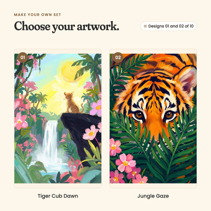 Designs 01 and 02 of 10: Tiger Cub Dawn, a tiger cub sitting on a dark rock beside a waterfall under a pale yellow sun, and Jungle Gaze, a close view of a tiger's face peeking through green leaves and pink flowers