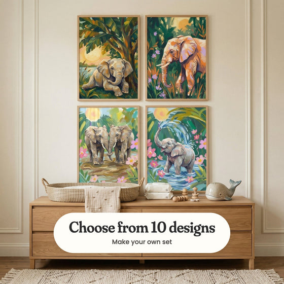 Cream panelled nursery with four jungle prints in light wood frames in two rows above a light wood dresser with a woven basket, folded cloths and a toy whale: Golden Jungle Calf, Golden Safari Giant, Gentle Trunk Connection and Joyful Water Play, with a label reading Choose from 10 designs, Make your own set