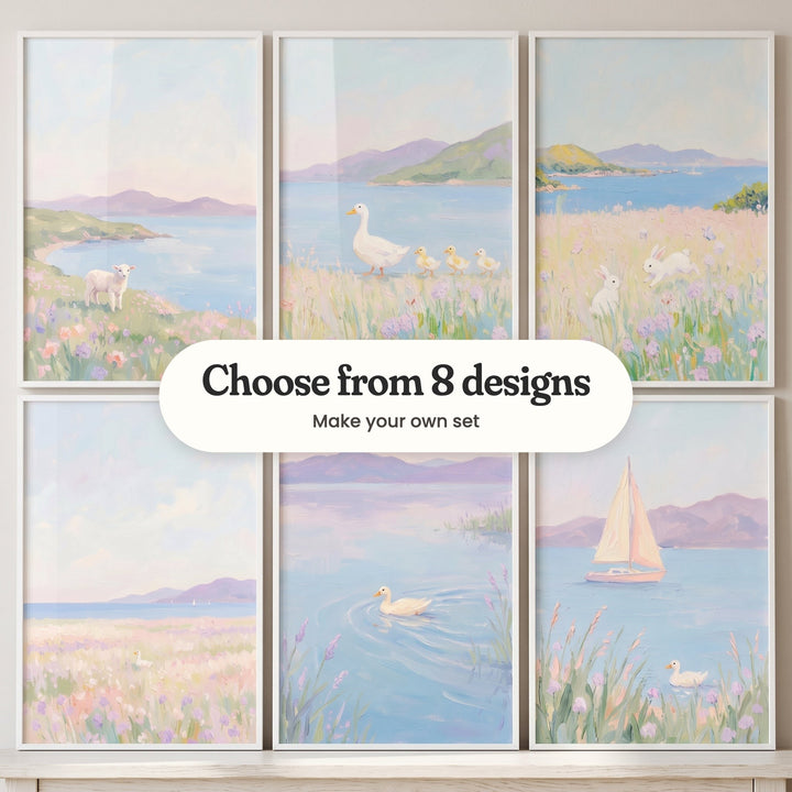 Six coastal meadow prints in white frames standing on a white ledge: a lamb above a bay, a duck leading ducklings, two bunnies in bloom, a wide pastel meadow, a duck on a lilac lake and a pink-sailed sailboat, with a label reading Choose from 8 designs, Make your own set