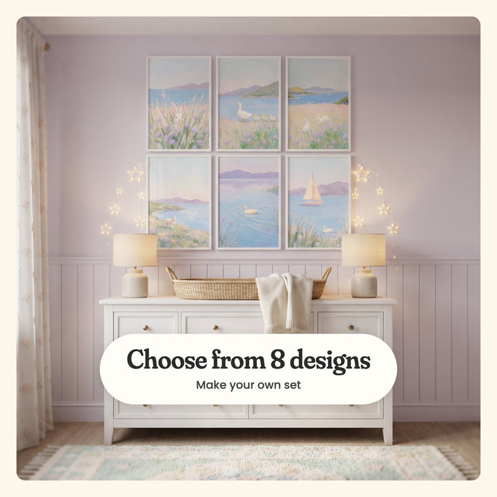 Lilac nursery with six coastal meadow prints in white frames above a white dresser, between two lamps: a bunny in tall grass, a duck leading ducklings, two bunnies in bloom, a lamb above a bay, a duck on a lilac lake and a sailboat, labeled Choose from 8 designs, Make your own set