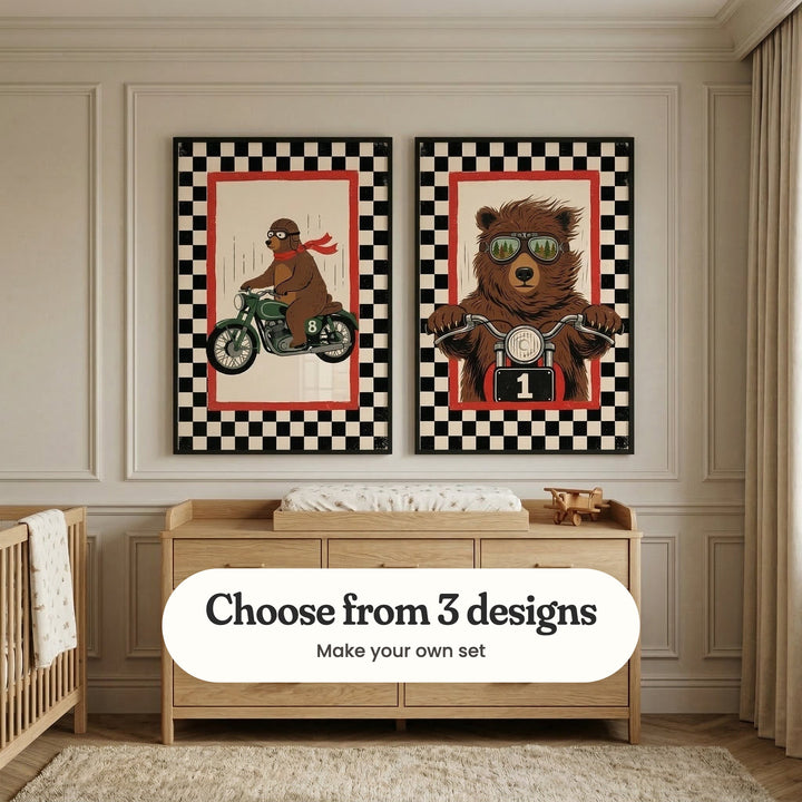 Pale panelled nursery with two motorcycle bear prints in black frames above a light wood dresser with a changing pad and a wooden toy plane, beside a light wood crib with a blanket and a linen curtain: Speedway Grizzly and Grizzly Road Racer, with a label reading Choose from 3 designs, Make your own set