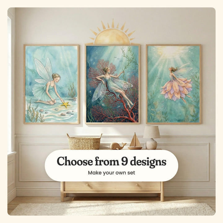 Nursery with three undersea fairy prints in light wood frames on a cream panelled wall under a sun wall decal, above a light wood dresser with a woven basket, a toy sailboat and a lamp: a fairy finding a starfish, a fairy resting on red coral and a fairy in a petal skirt rising toward the light, labeled Choose from 9 designs, Make your own set