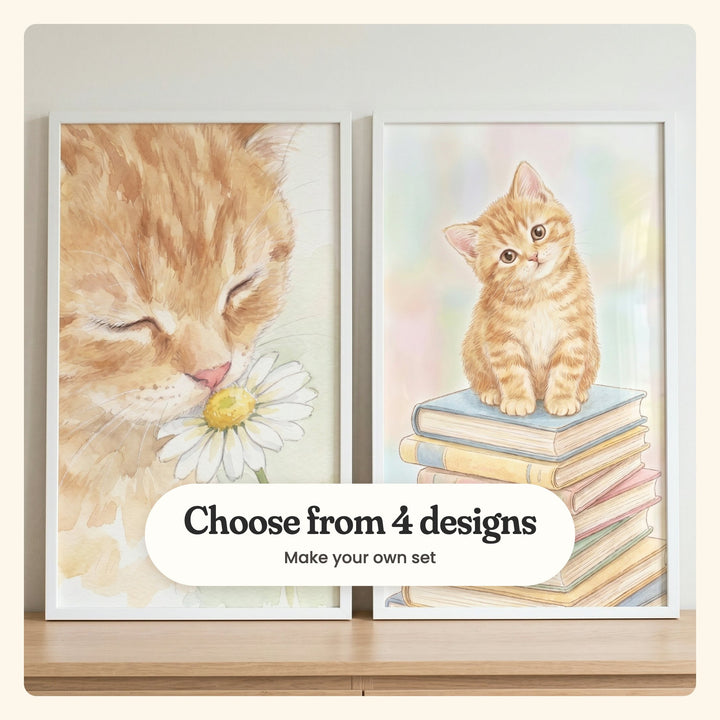 Close view of two ginger kitten prints in white frames leaning on a light wood shelf: Sweet Floral Whiskers and The Bookish Tabby, labeled Choose from 4 designs, Make your own set