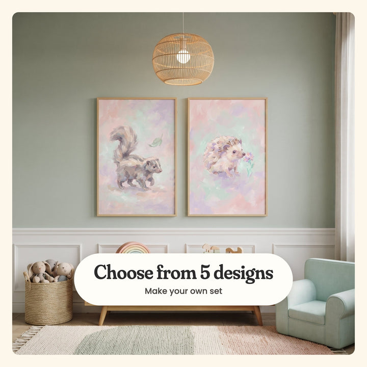 Sage green panelled room with two woodland animal prints in light wood frames above a low wood bench with a rainbow stacker and wooden toys, under a rattan pendant light, beside a basket of plush bunnies and a mint armchair: Pastel Skunk Dreams and Pastel Flower Sniff, labeled Choose from 5 designs, Make your own set