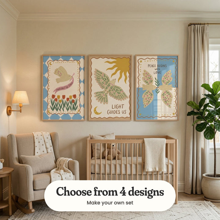 Cream nursery with three folk bird prints in light wood frames above a light wood crib with a teddy bear and a knit blanket, beside a grey rocking armchair, a wall lamp, a potted fiddle leaf fig and linen curtains: Graceful Tulip Flight, Golden Sun Dove and Floral Peace Doves, with a label reading Choose from 4 designs, Make your own set