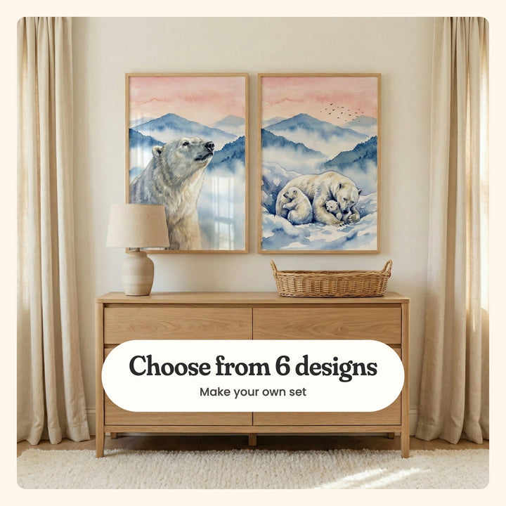 Cream nursery between linen curtains with two polar bear prints in light wood frames above a light wood dresser with a table lamp and a woven basket: Arctic Mist Gaze and Arctic Family Embrace, labeled Choose from 6 designs, Make your own set