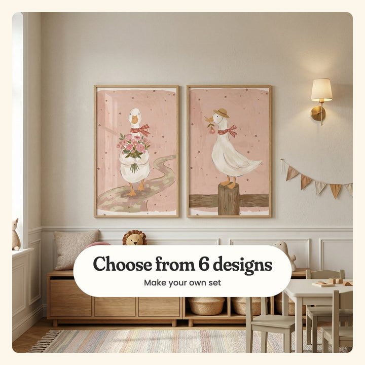 Kids' room with two goose prints in light wood frames on a panelled wall beside a brass sconce, above an oak cabinet with woven baskets, a plush lion and bunting, near a kids' table and chairs on a striped rug: a goose carrying a bouquet down a winding path and a goose in a straw hat on a fence post, labeled Choose from 6 designs, Make your own set