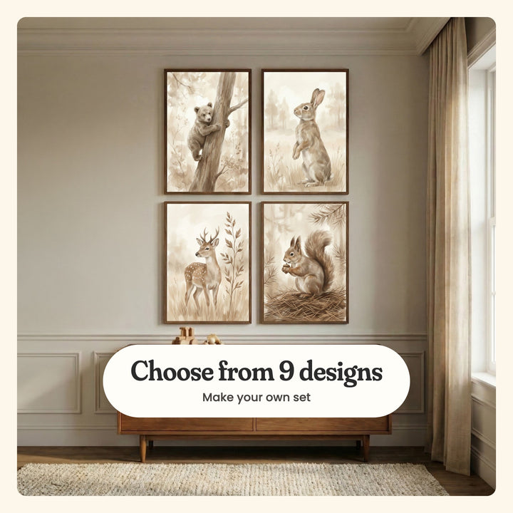 Four woodland animal prints in dark wood frames on a paneled wall above a low walnut sideboard with wooden toys, beside a tall window with linen curtains, labeled Choose from 9 designs, Make your own set