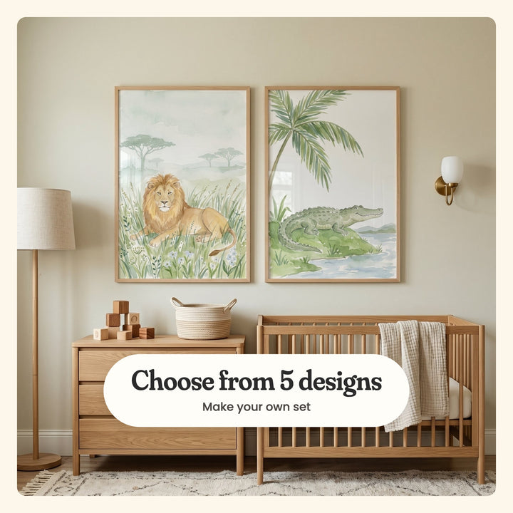 Soft greige nursery with two wild animal prints in light wood frames above a light wood dresser with wooden blocks and a woven basket and a light wood crib with a muslin blanket, beside a floor lamp and a wall light: Golden Savanna King and Smiling Swamp Friend, labeled Choose from 5 designs, Make your own set