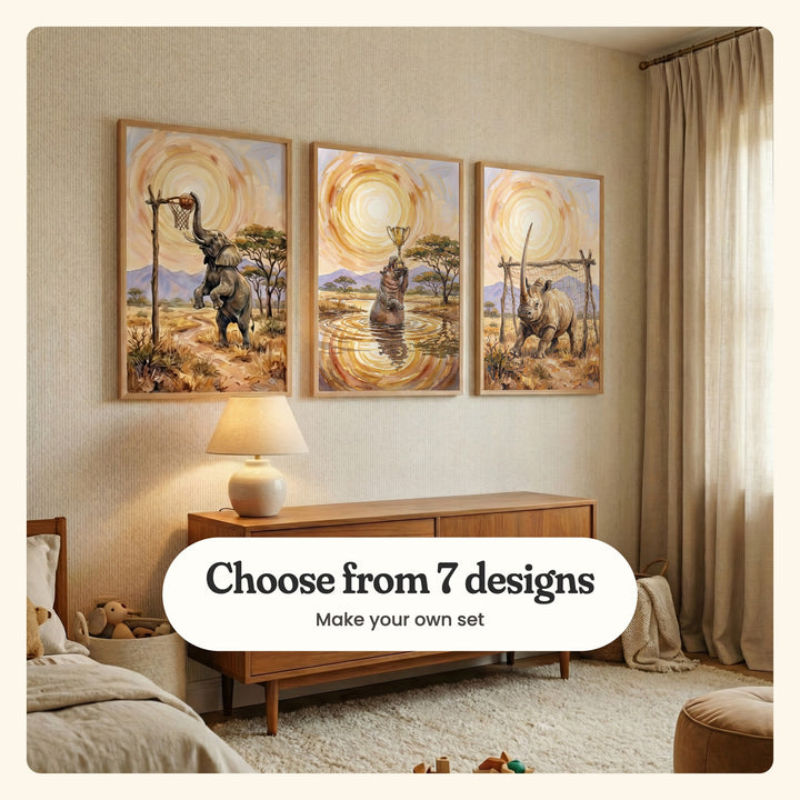 Beige nursery with three safari sports prints in light wood frames above a walnut dresser with a table lamp, beside a bed with plush toys, a linen curtain and a fluffy rug: Savanna Hoop Star, Savanna Victory and Sunlit Rhino Spirit, labeled Choose from 7 designs, Make your own set