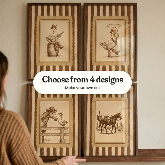 Four sepia western prints with brown and cream striped borders in dark wood frames on a ledge: a goose playing a banjo, a goose spinning a lasso, a horse in a cowboy hat meeting a goose and a saddled horse by the cactus, with a label reading Choose from 4 designs, Make your own set