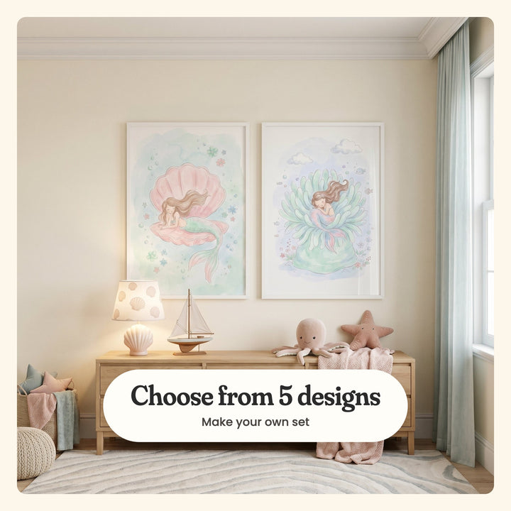 Cream room with two mermaid prints in white frames above a light wood sideboard with a seashell table lamp, a toy sailboat, a plush octopus, a plush starfish and a pink knit blanket, beside a knit pouf, a basket of cushions and a sheer curtain: Seashell Dreams and Serene Sea Slumber, labeled Choose from 5 designs, Make your own set