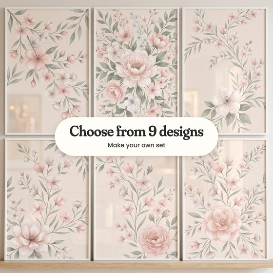 Six floral prints in white frames in two rows on a wood ledge: blossom branches sweeping in from a corner, a full bouquet with a blush peony at its center, blossom stems with one large white bloom, blossom stems rising from an open blush bloom, blossom stems with a pink peony and blossom sprays around a full blush rose, with a label reading Choose from 9 designs, Make your own set