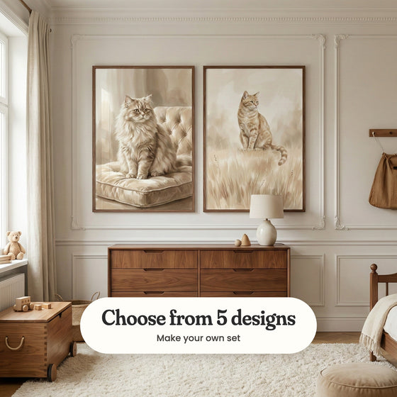 Cream panelled nursery with two cat prints in dark wood frames above a walnut dresser with a table lamp, beside a wooden toy chest, a teddy bear on the windowsill and a shaggy cream rug: Golden Feline Grace and Golden Meadow Feline, with a label reading Choose from 5 designs, Make your own set