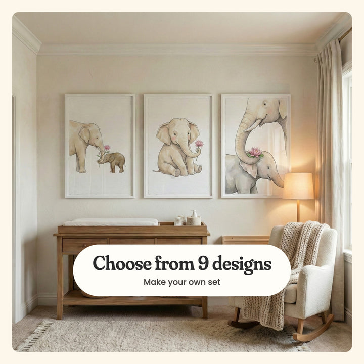 Cream nursery with three elephant prints in white frames above a wooden changing table, beside a table lamp, a cream rocking chair with a knit throw and a fluffy rug: Gentle Elephant Bond, Baby Elephant Bloom and Motherly Lotus Blessing, labeled Choose from 9 designs, Make your own set
